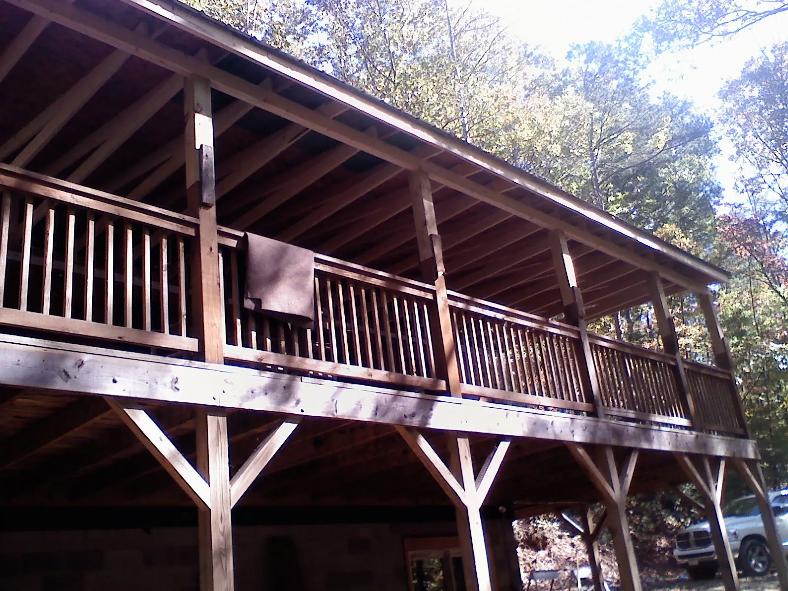 Timber framing under a new elevated porch and deck in Buffalo